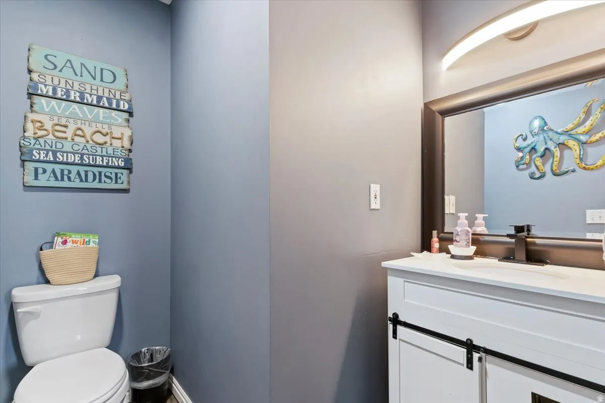 Bathroom featuring vanity and toilet