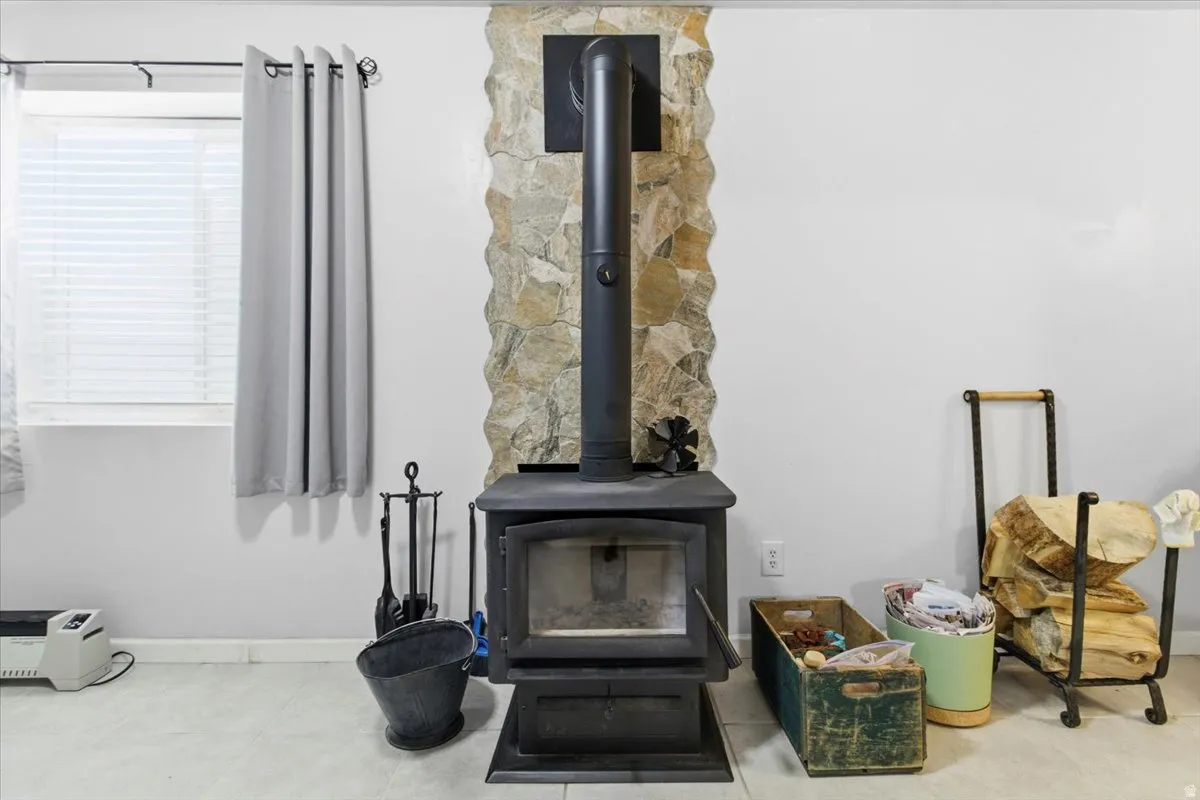 Detailed view of a wood stove and baseboards