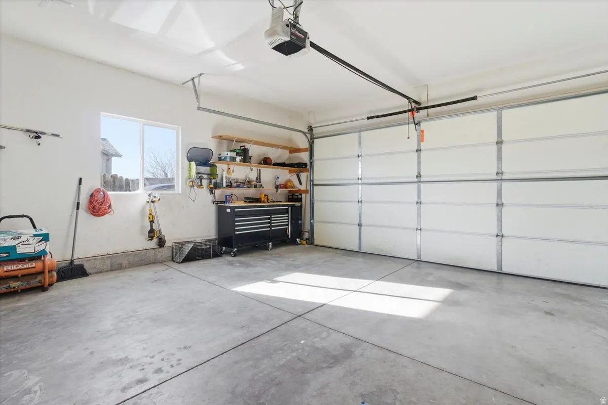 Garage featuring a garage door opener