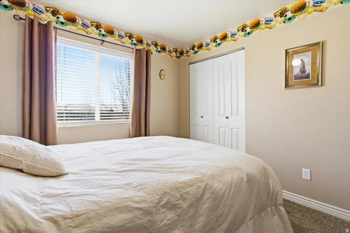 Bedroom with a closet and carpet