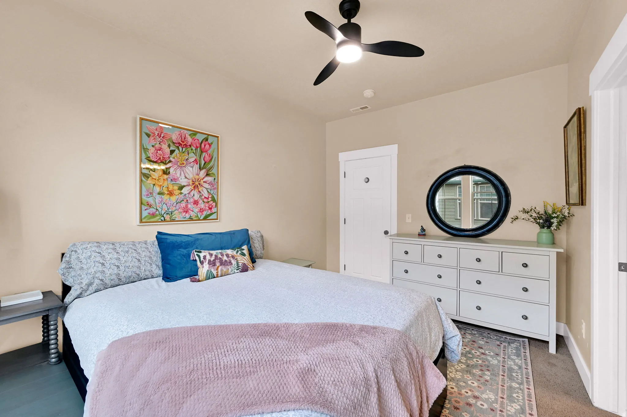 Bedroom with ceiling fan and carpet