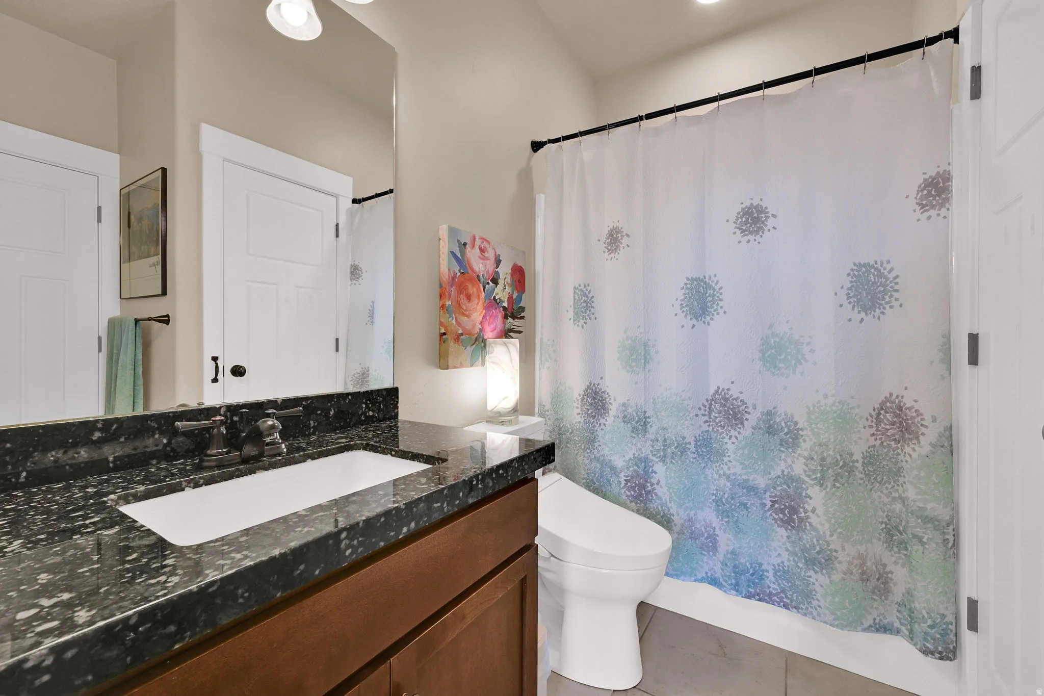 Bathroom featuring vanity and light tile patterned floors