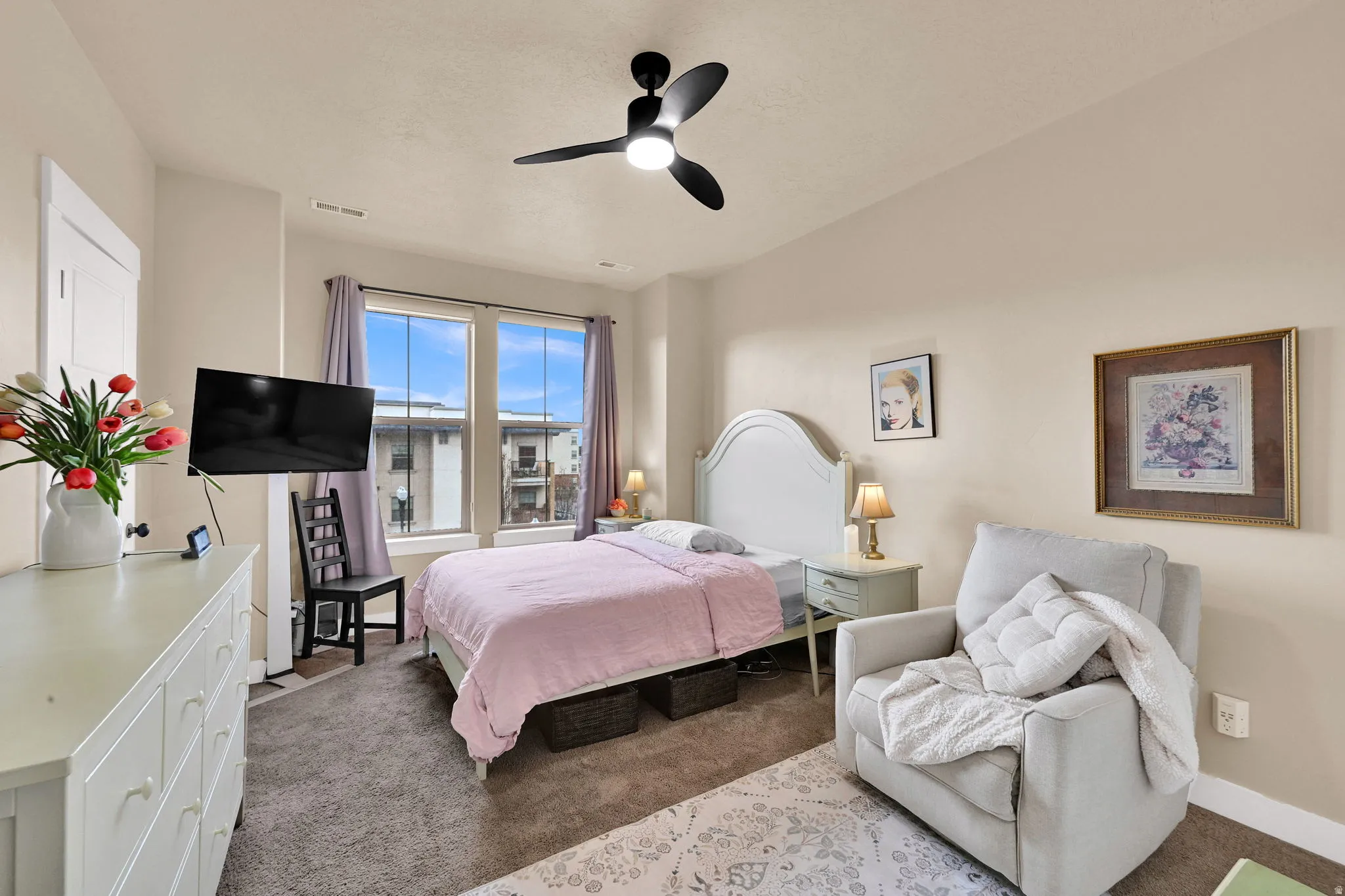 Bedroom featuring carpet and ceiling fan