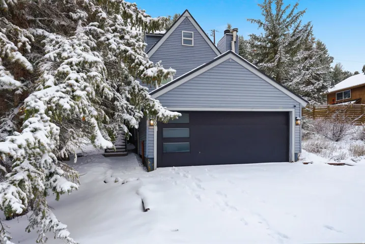 View of front of property featuring a garage