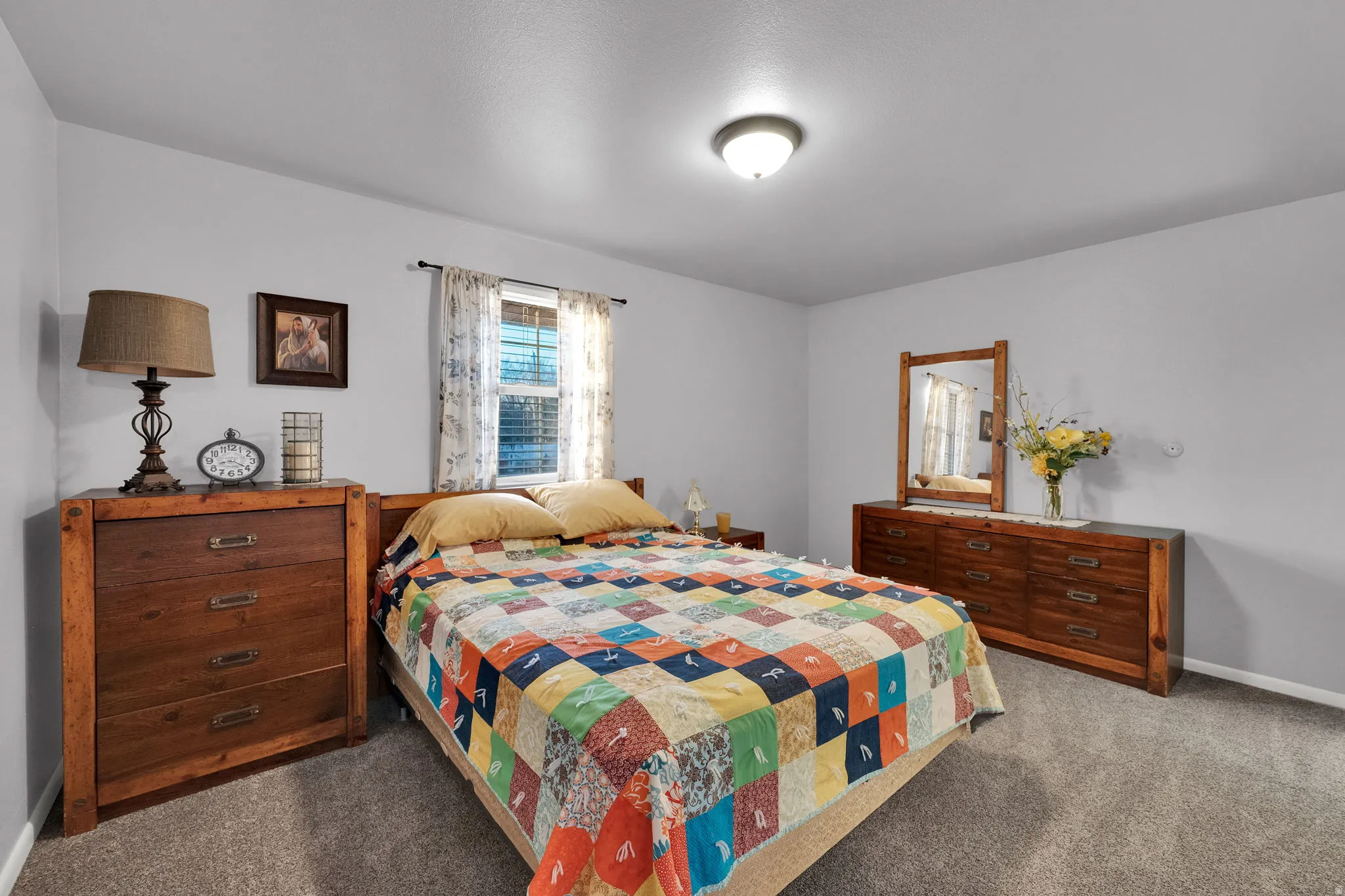 Carpeted bedroom featuring baseboards