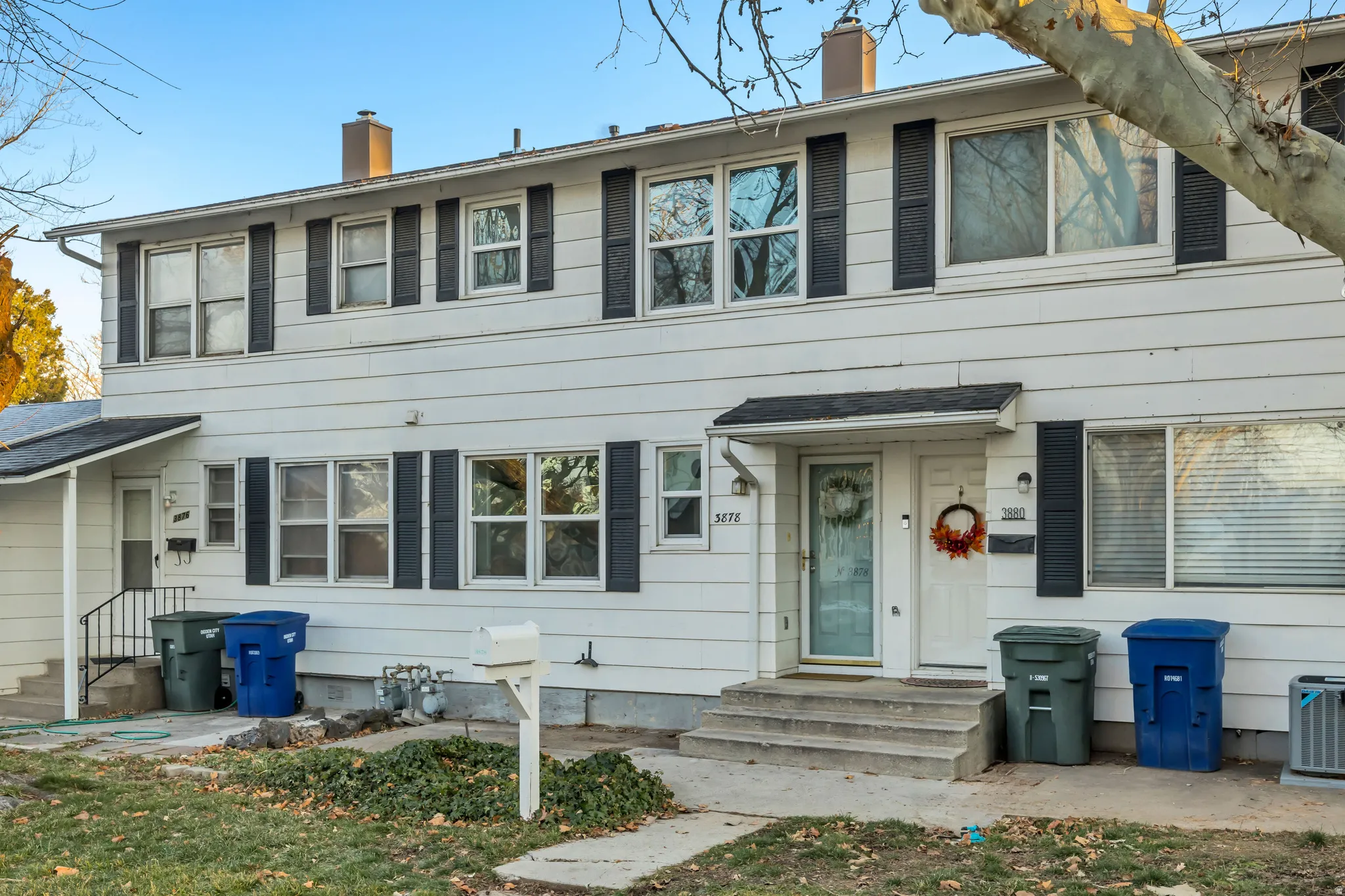 View of front of house with a chimney and entry steps