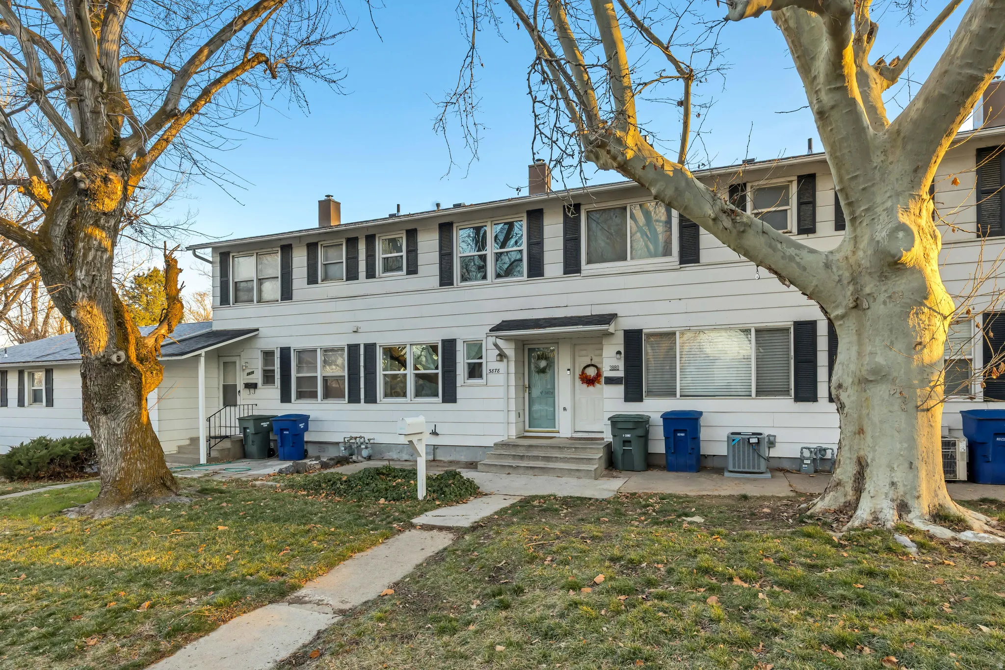 View of front of property featuring a chimney and a front yard
