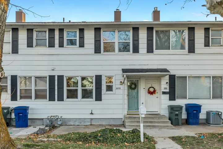 View of front of house featuring a chimney