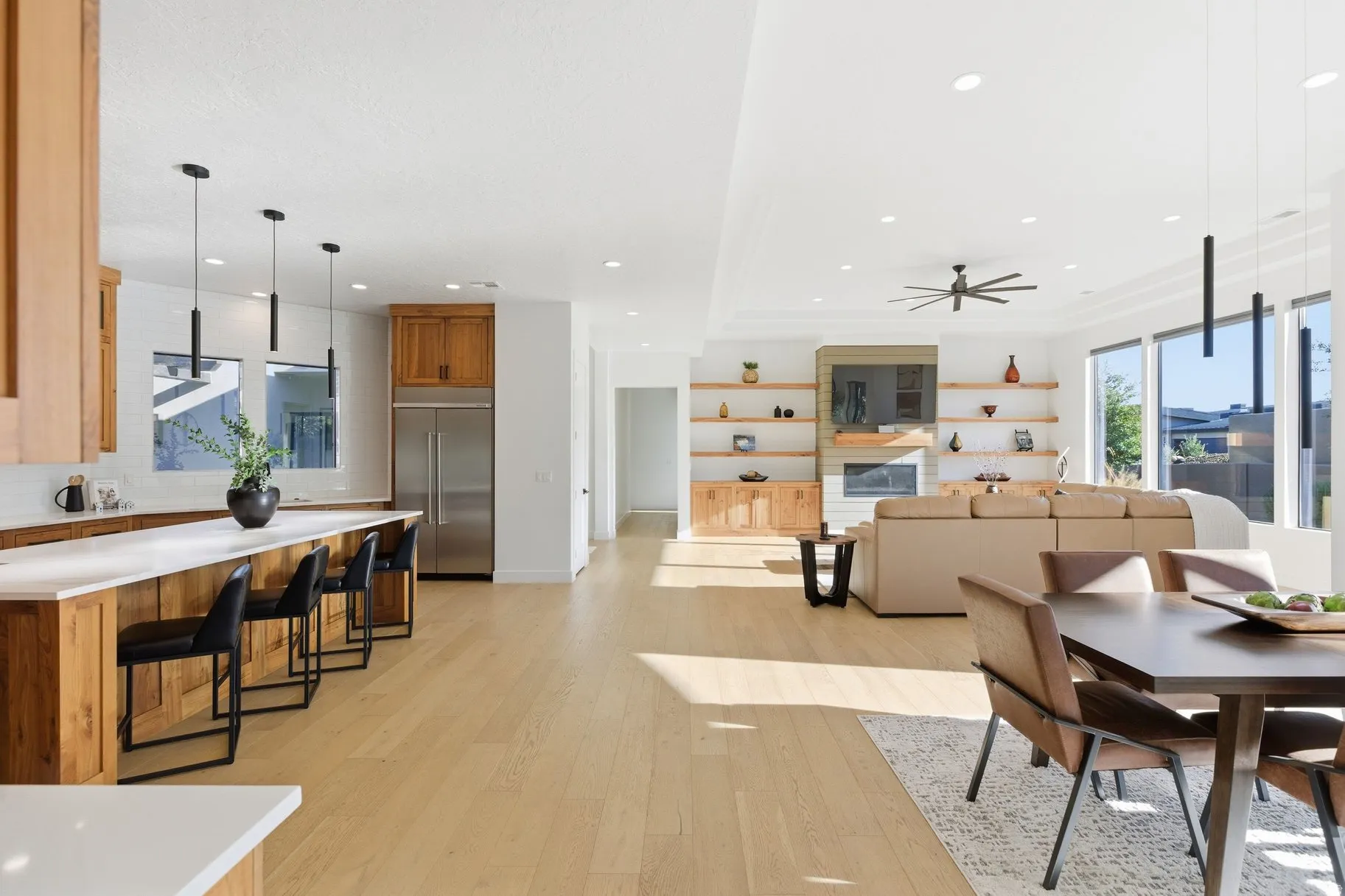 Dining room with light wood finished floors, recessed lighting, and ceiling fan