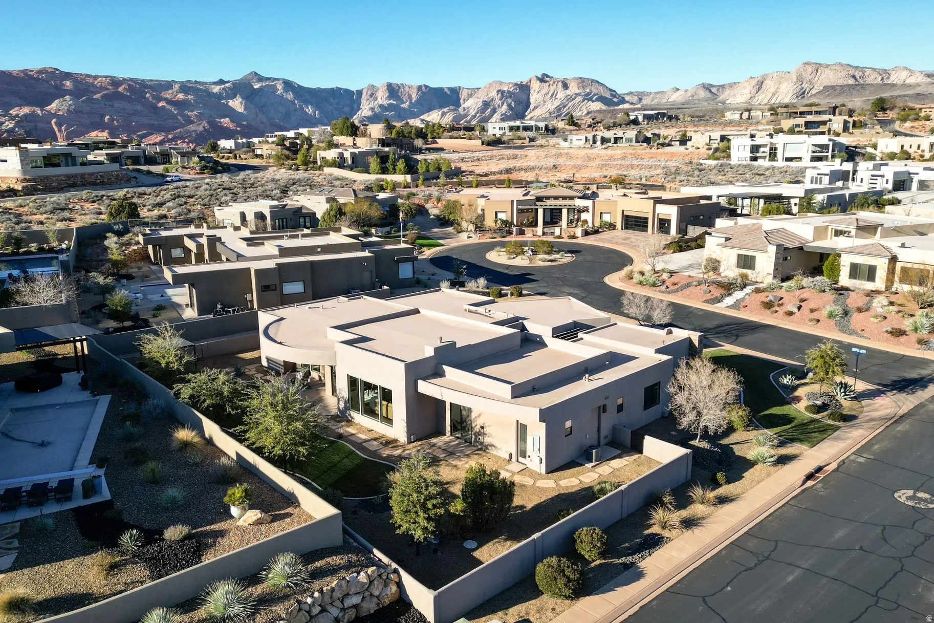Aerial view of residential area featuring a mountainous background