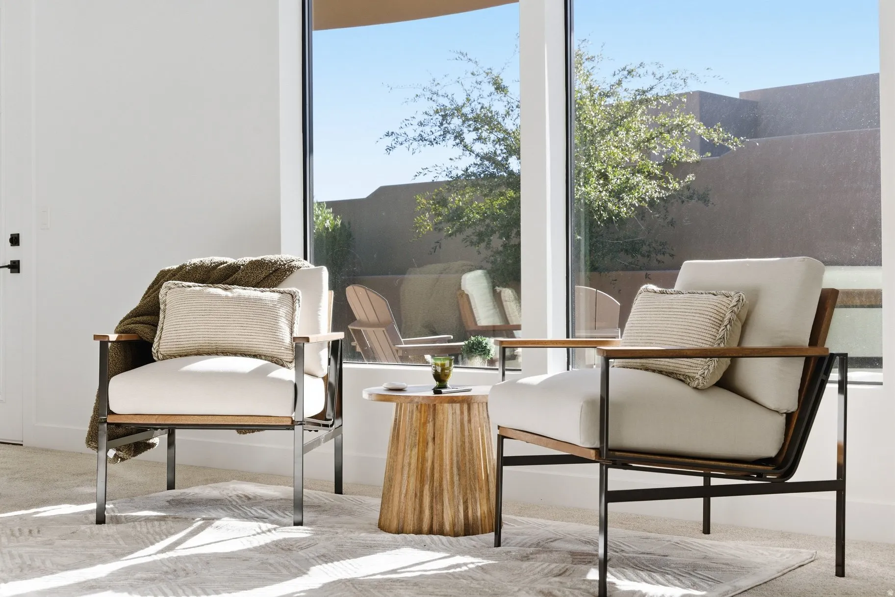 Sitting room featuring light colored carpet