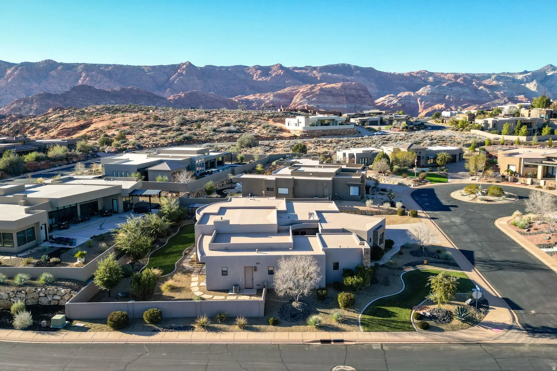 Aerial view of residential area featuring a mountainous background