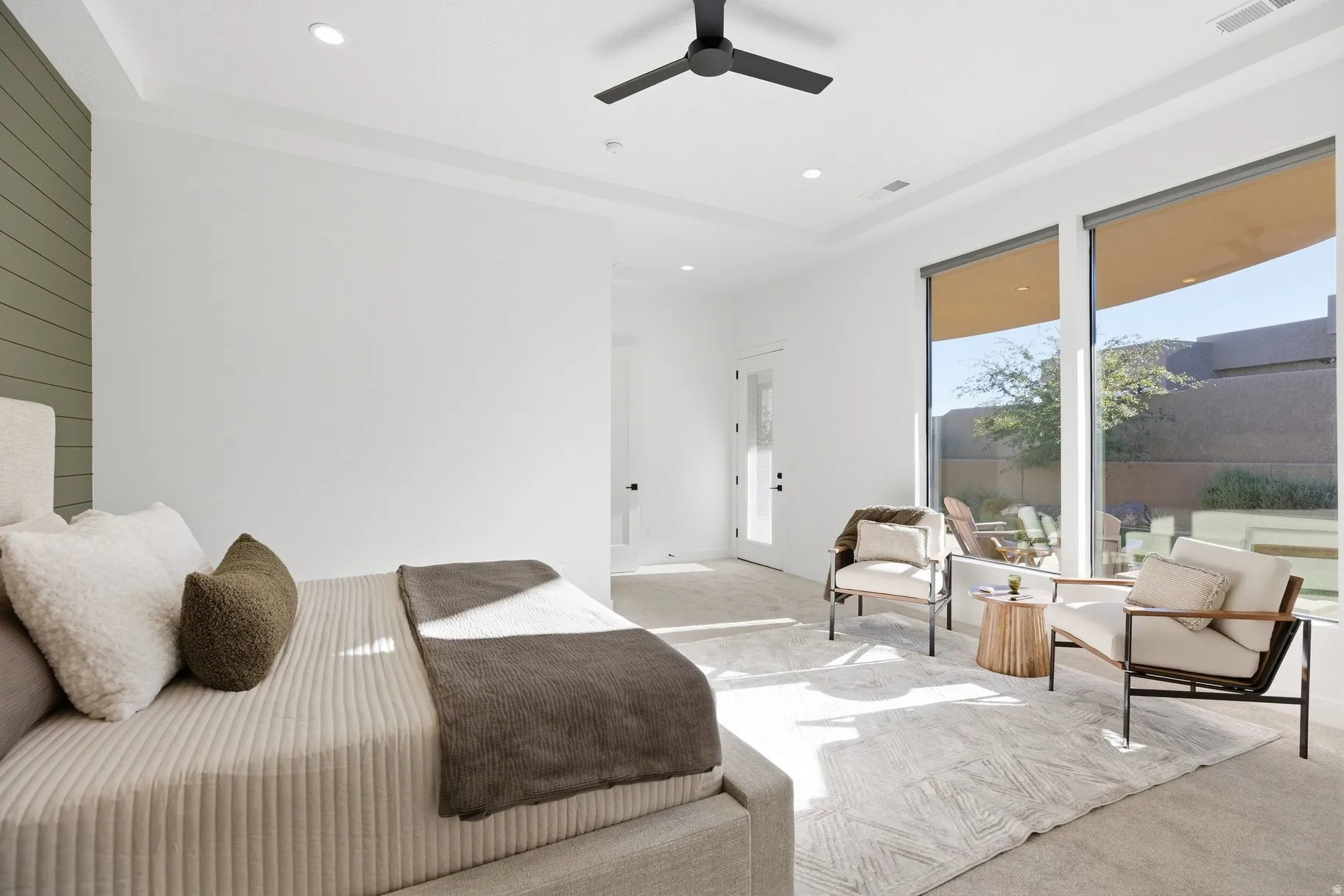 Bedroom with light colored carpet, recessed lighting, and ceiling fan