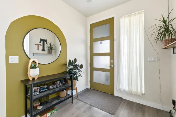 Entryway with wood finished floors and baseboards