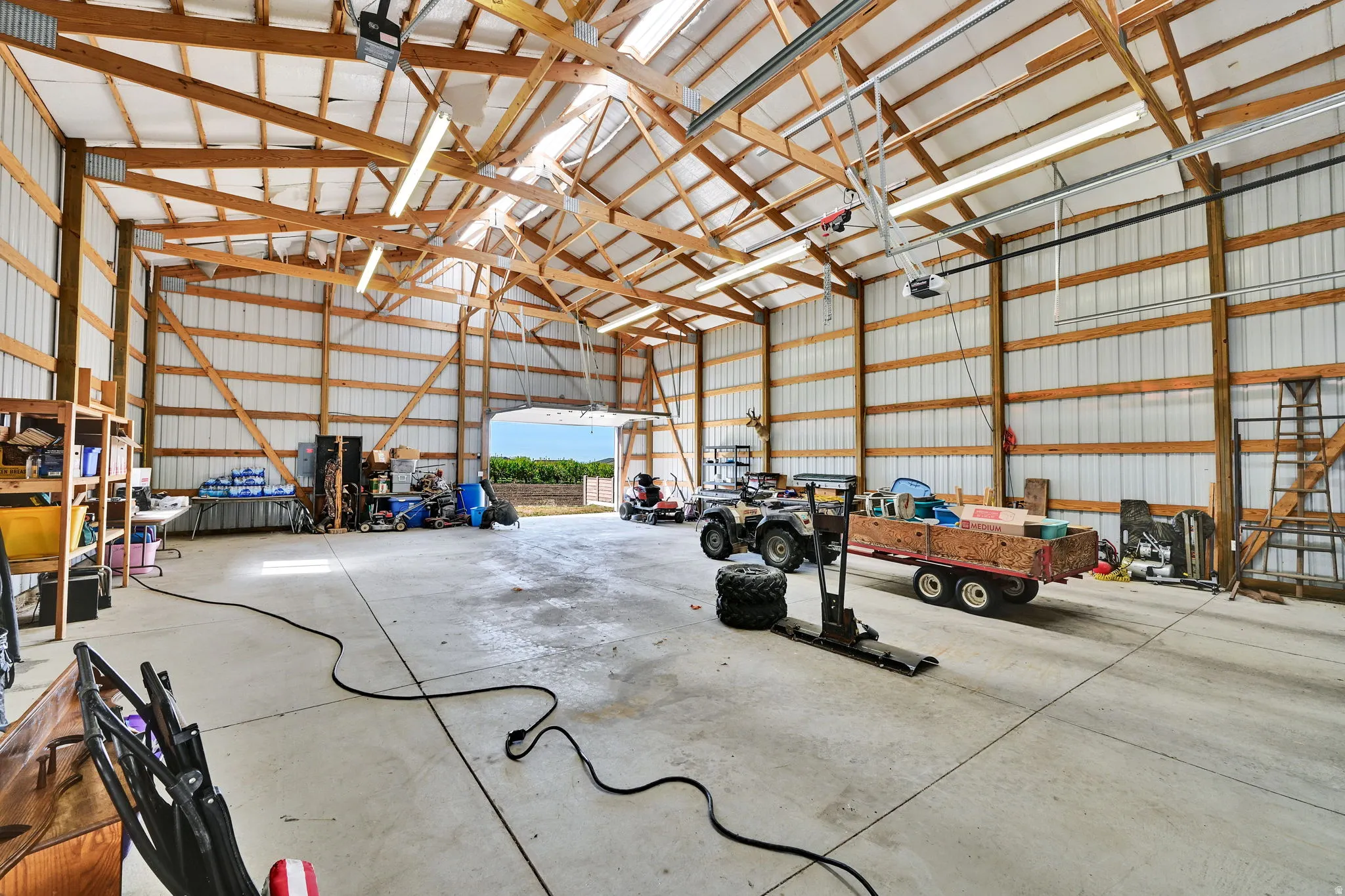Showing Empty Garage featuring metal wall Solar Panels on Roof Low Utility Bill