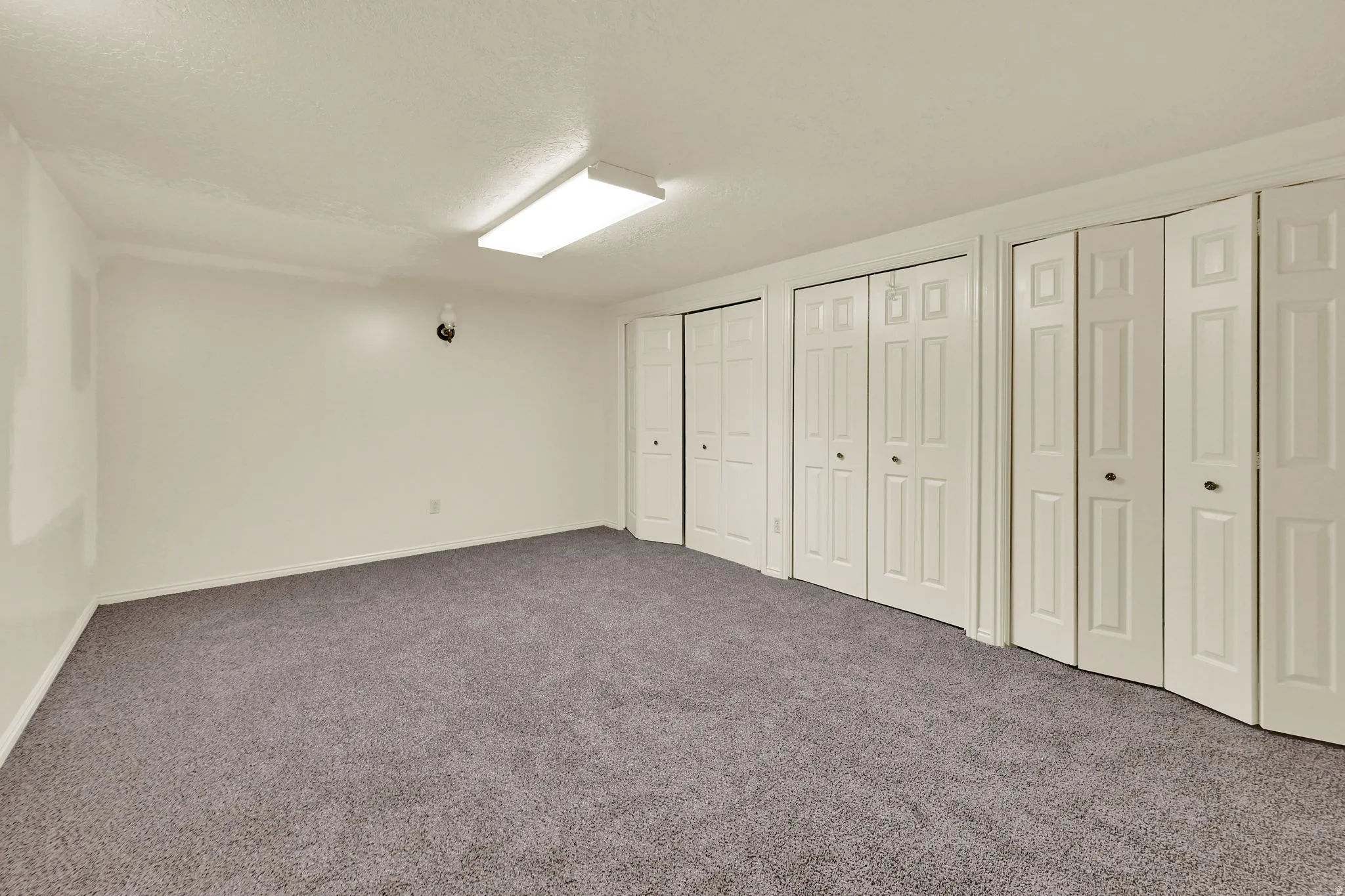 Need window for bedroom with two closets, carpet flooring, and a textured ceiling
