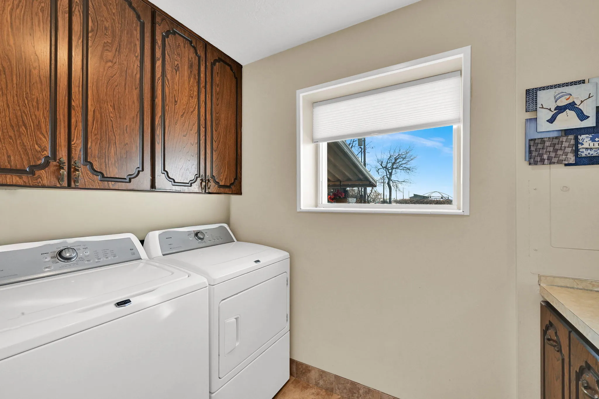Laundry room with cabinet space and separate washer and dryer