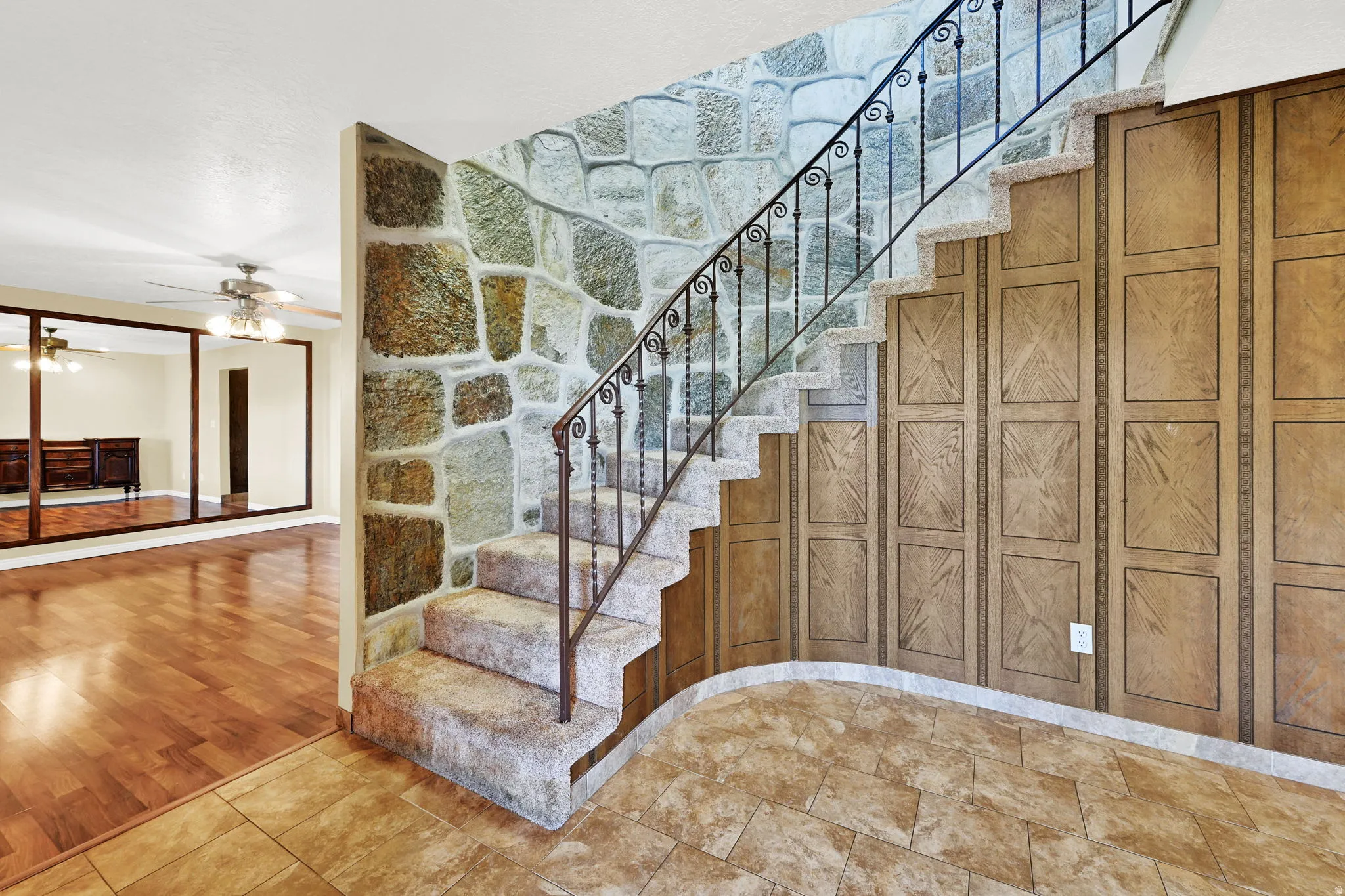 Shown Unfurnished View of Stairs and Dining to Left