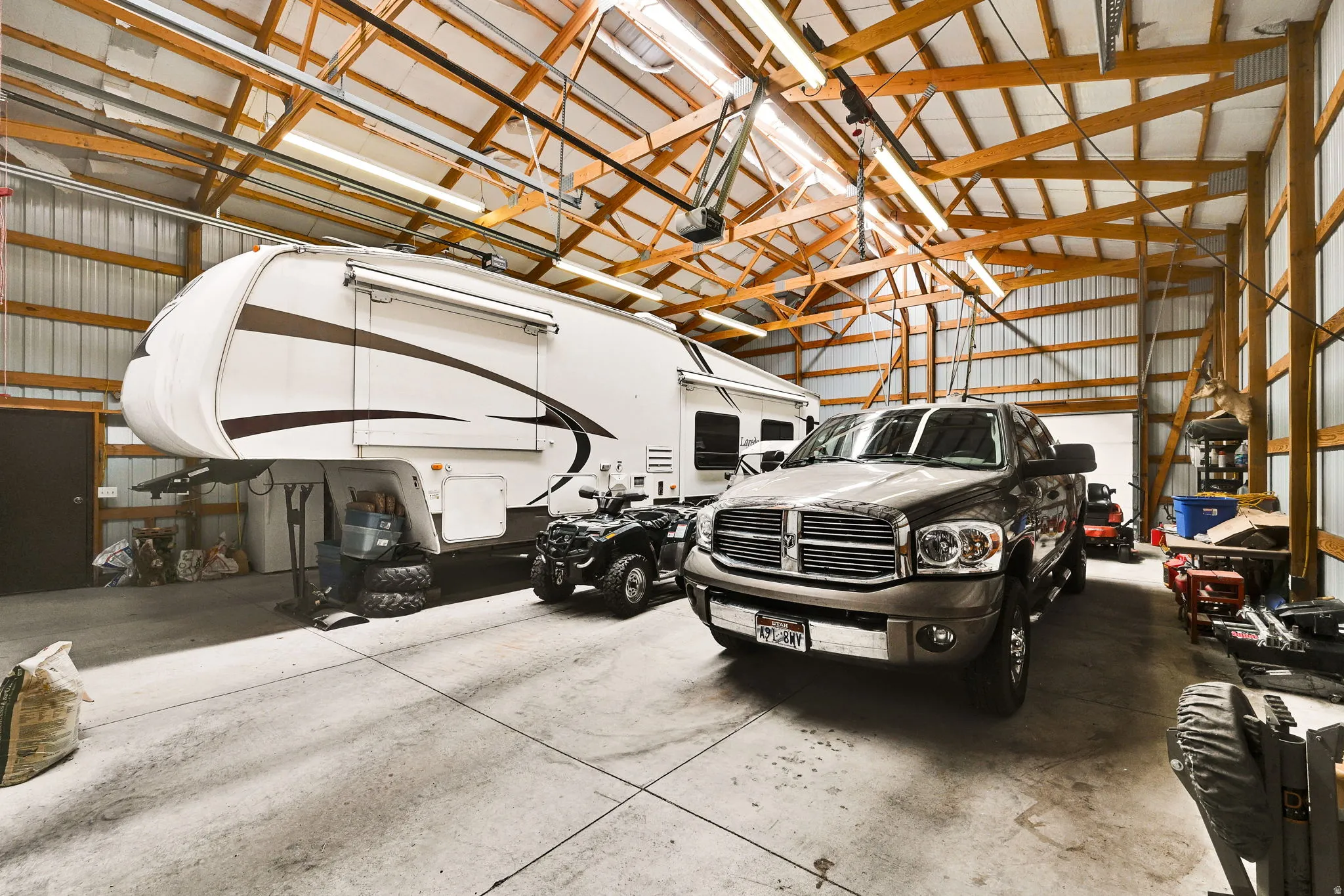 Garage featuring metal wall EXTRA HEIGHT WIDTH Solar Panels on Roof Low Utility Bill