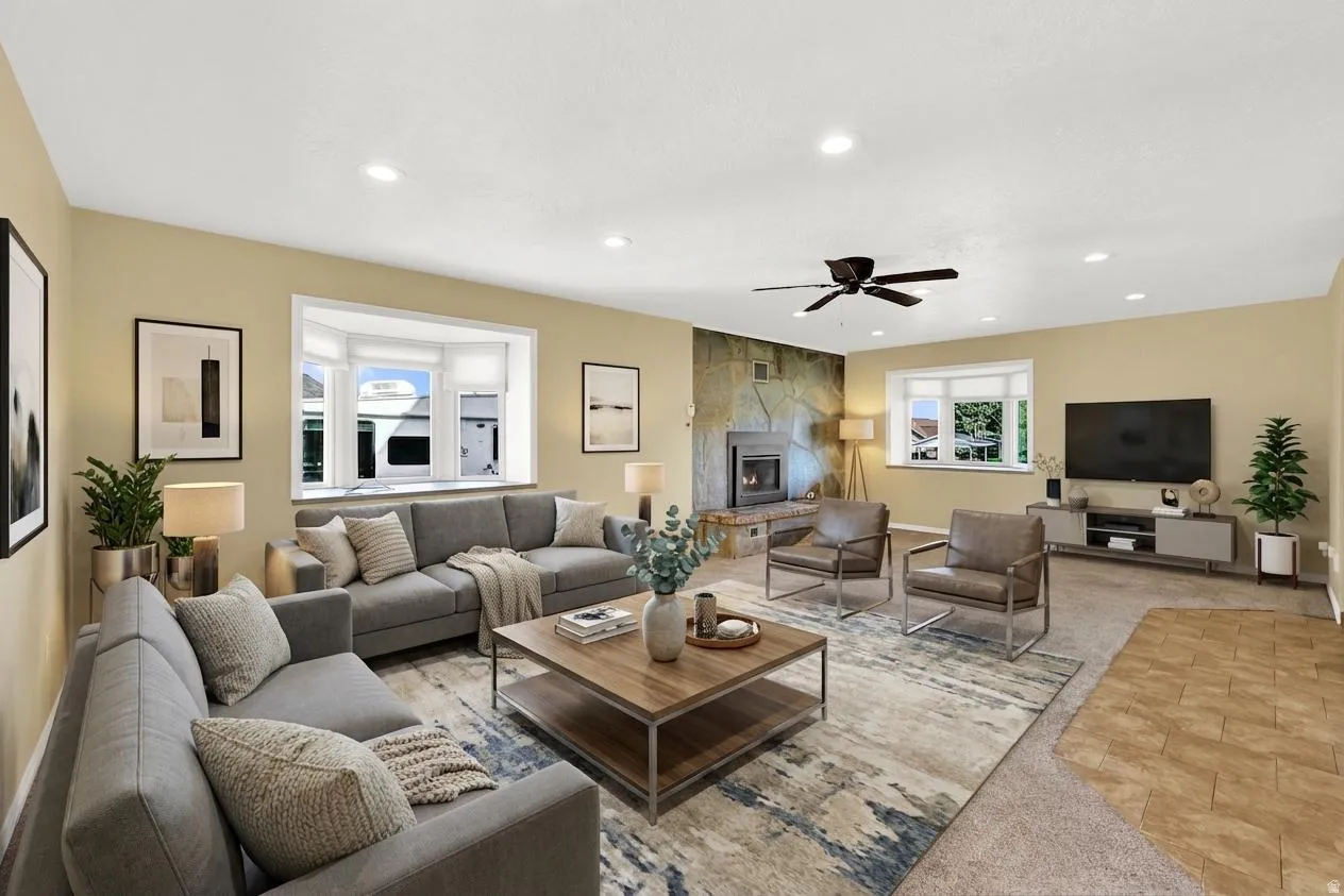 Right Entrance Virtual Staging. Family/Living area featuring ceiling fan, a fireplace, recessed lighting, and light colored carpet
