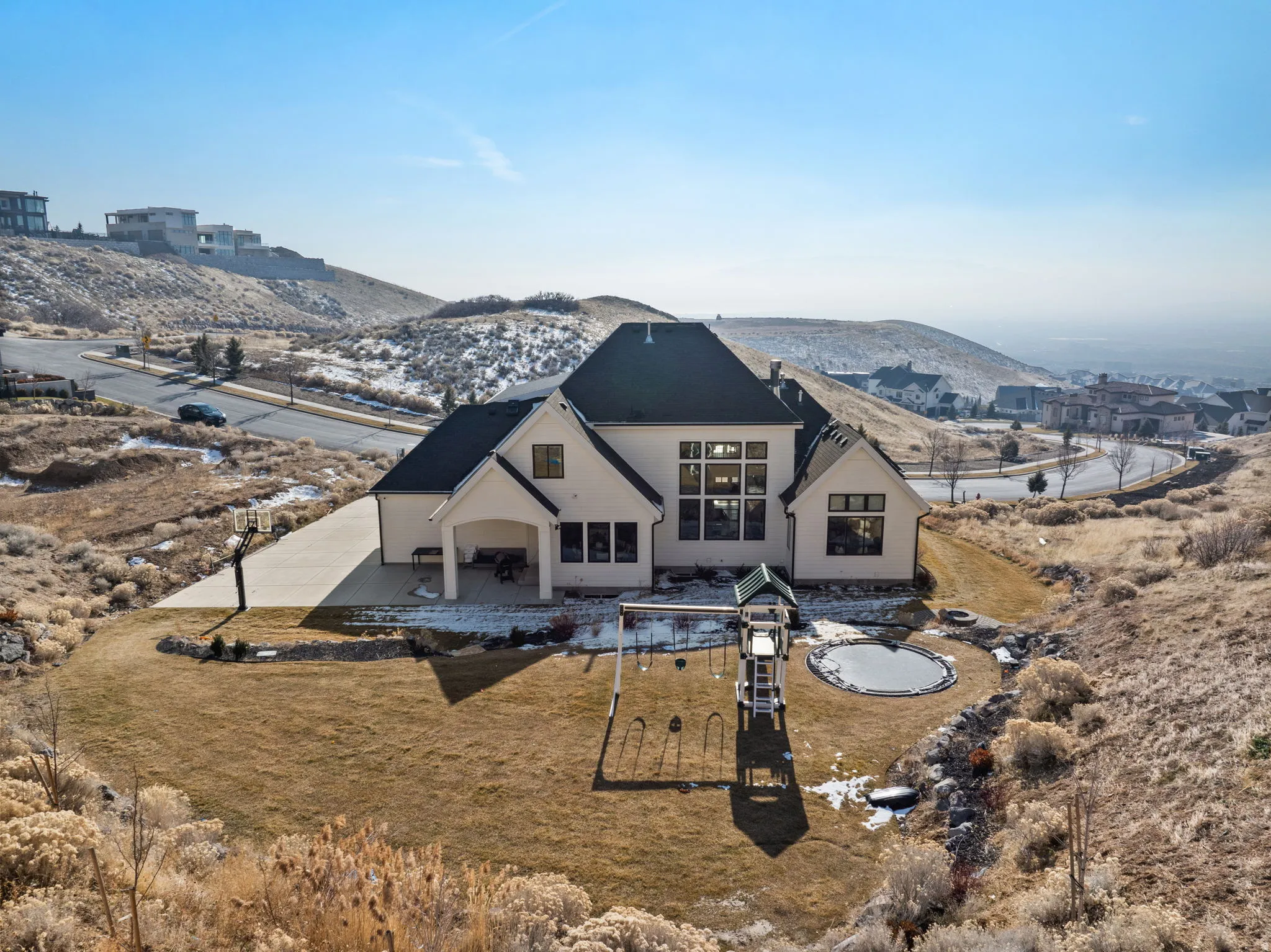 Rear view of house featuring a patio and a mountain view