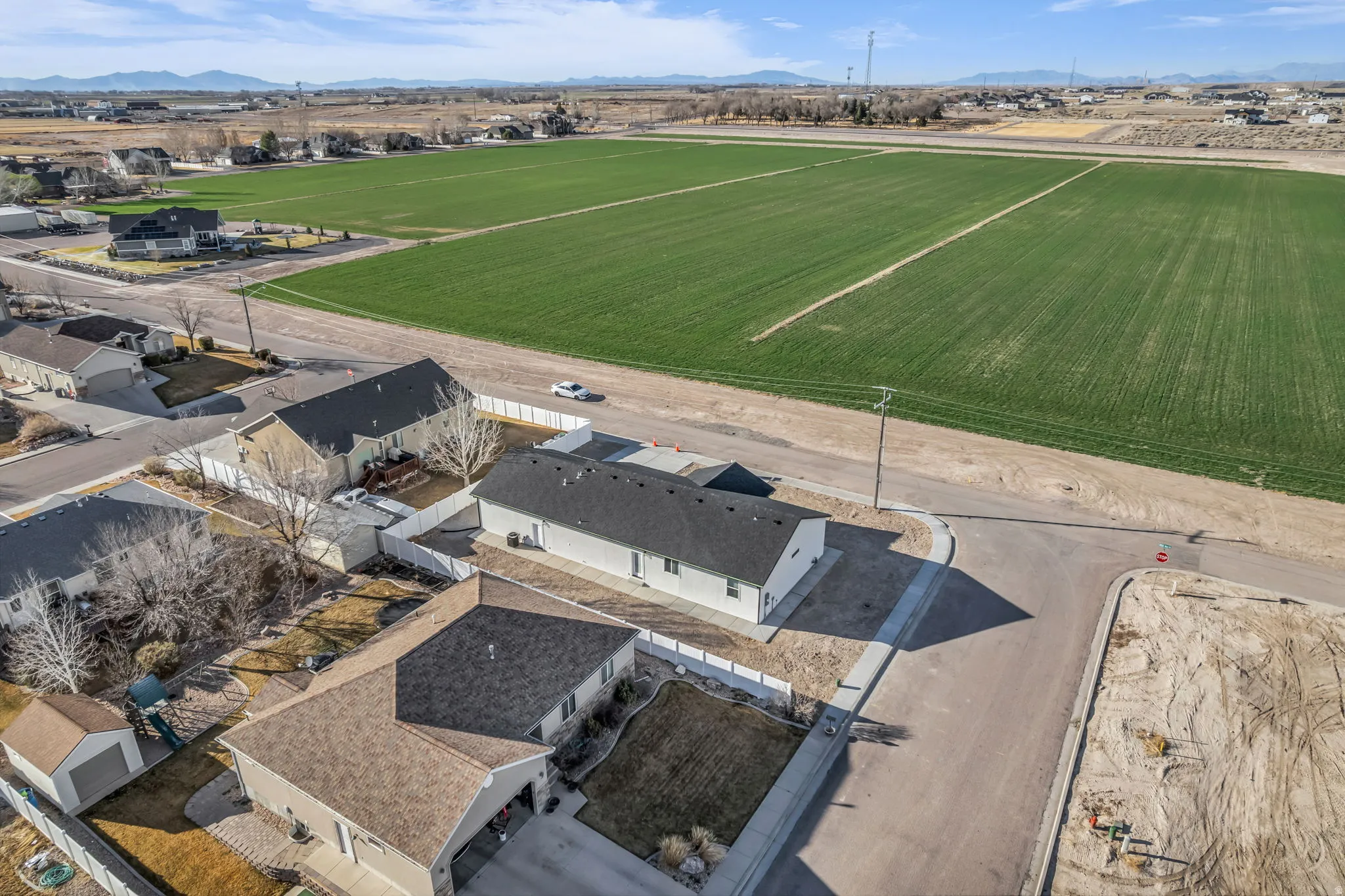 Aerial perspective of suburban area with a mountain backdrop