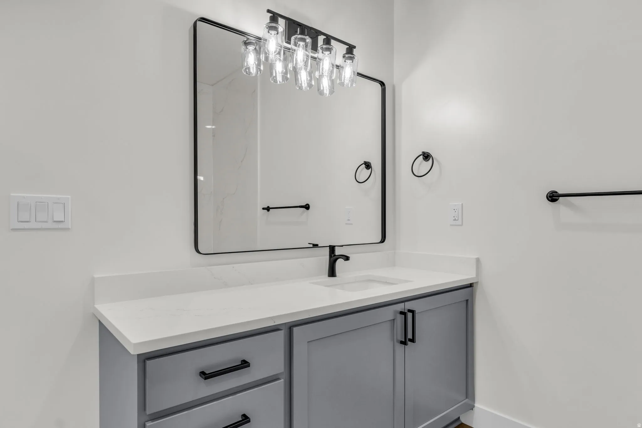 Bathroom featuring vanity and baseboards