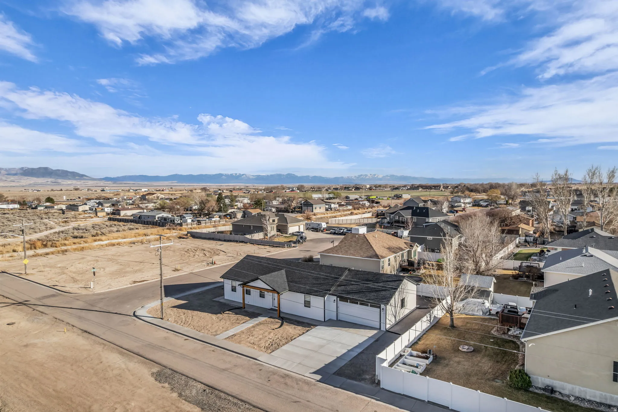 Aerial view of residential area featuring mountains