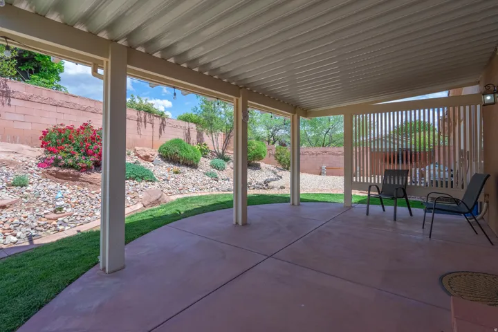 Fenced backyard with a patio area