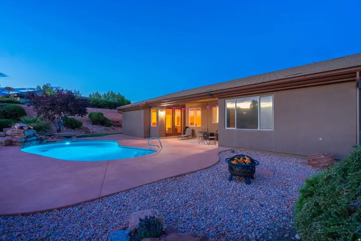 Swimming pool featuring a fire pit and a patio