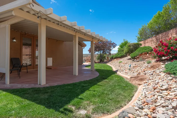 View of yard with a patio area and french doors