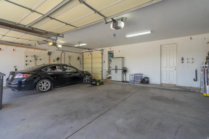 Garage with a garage door opener and water heater