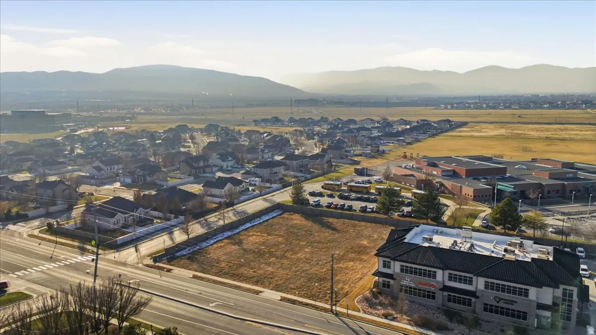 Aerial perspective of suburban area with a mountainous background