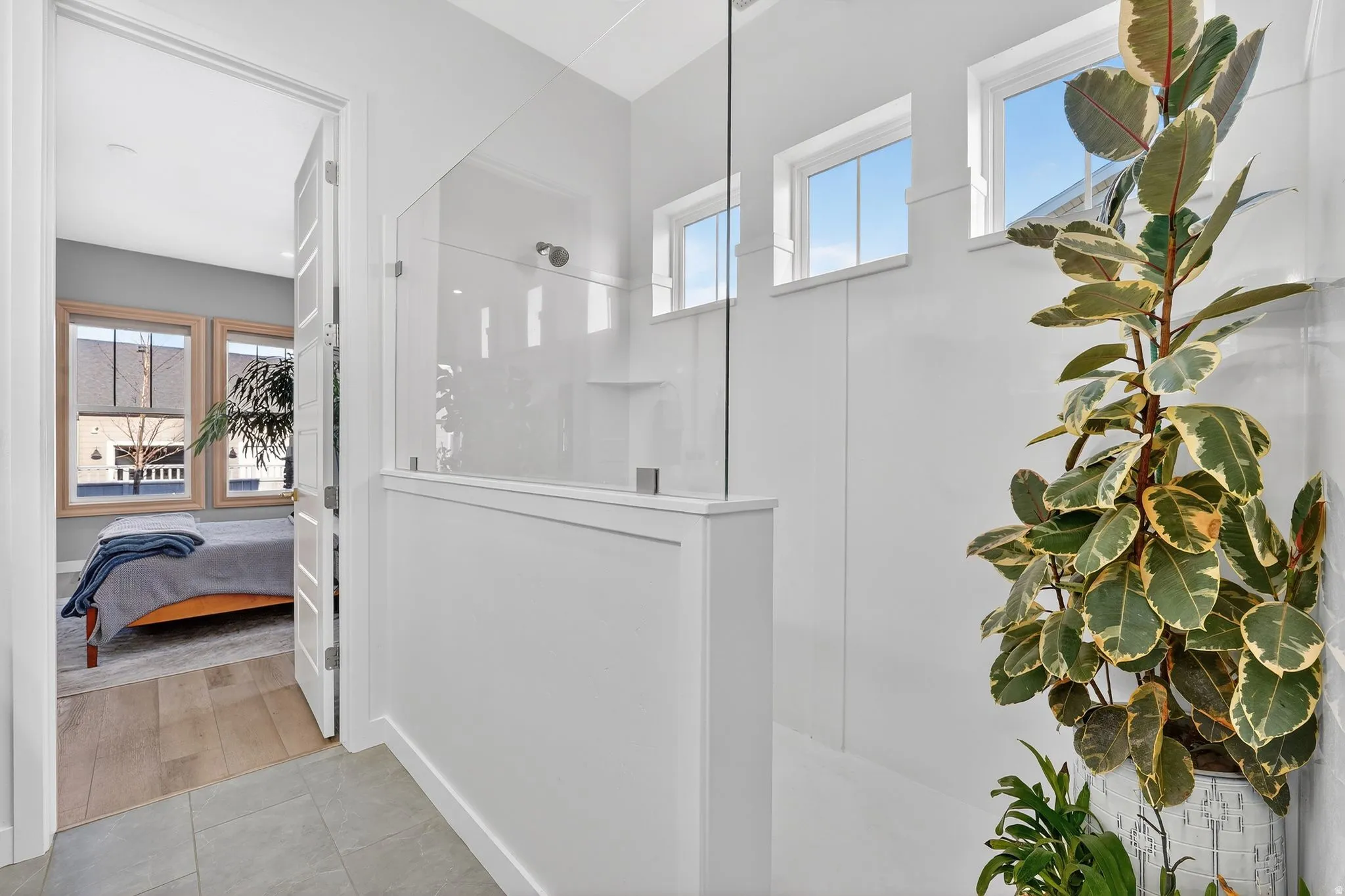 Owners full bath featuring double vanity, a spacious closet, and large walk in shower