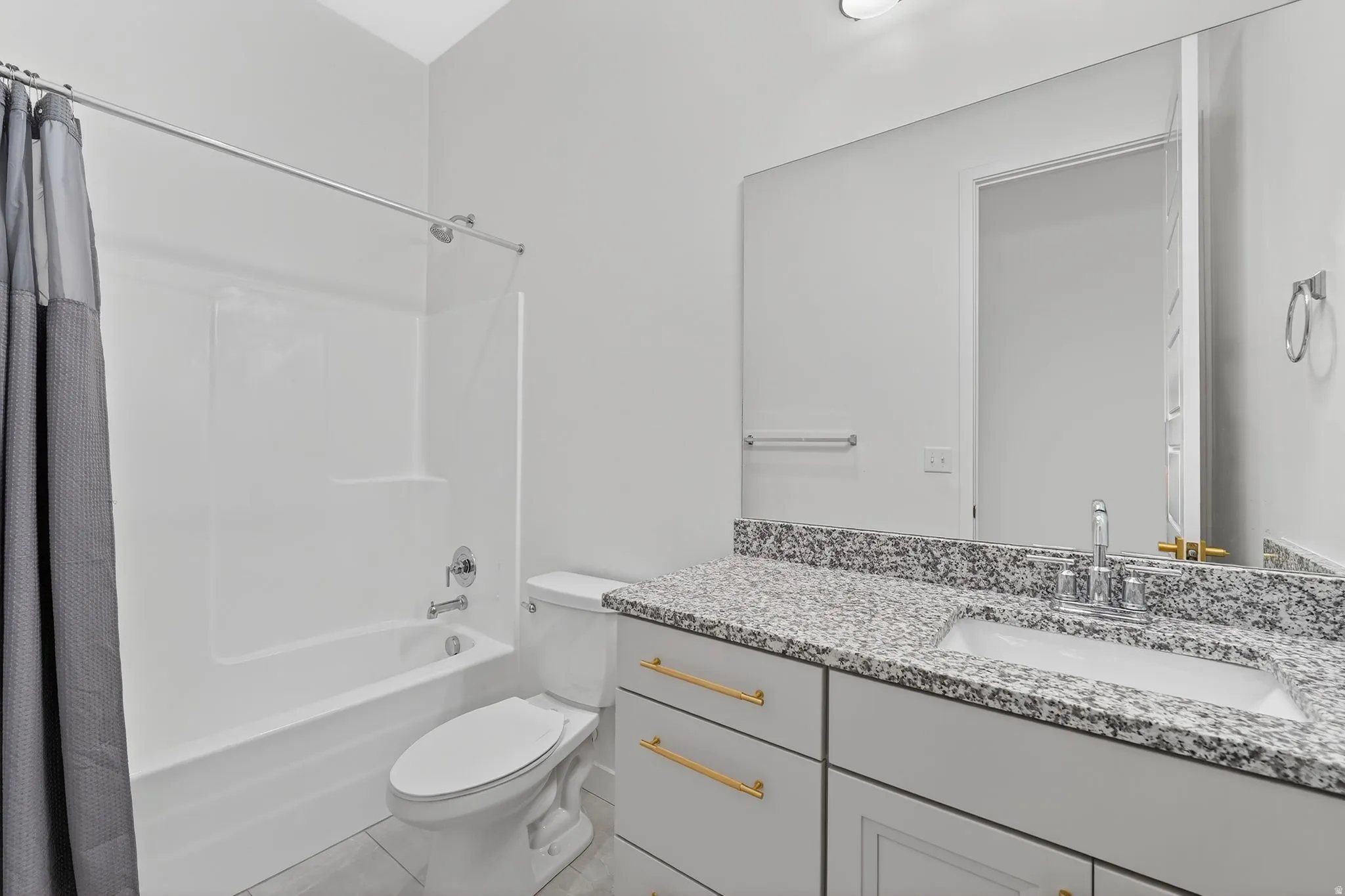 Full bath with shower / tub combo and vanity next to upstairs bedrooms
