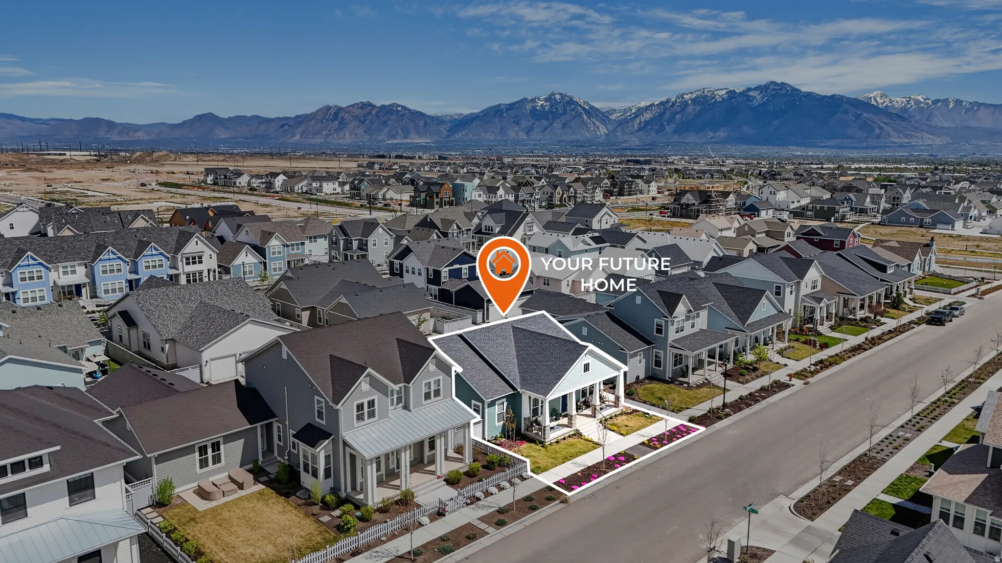 Aerial perspective of suburban area featuring a mountain backdrop