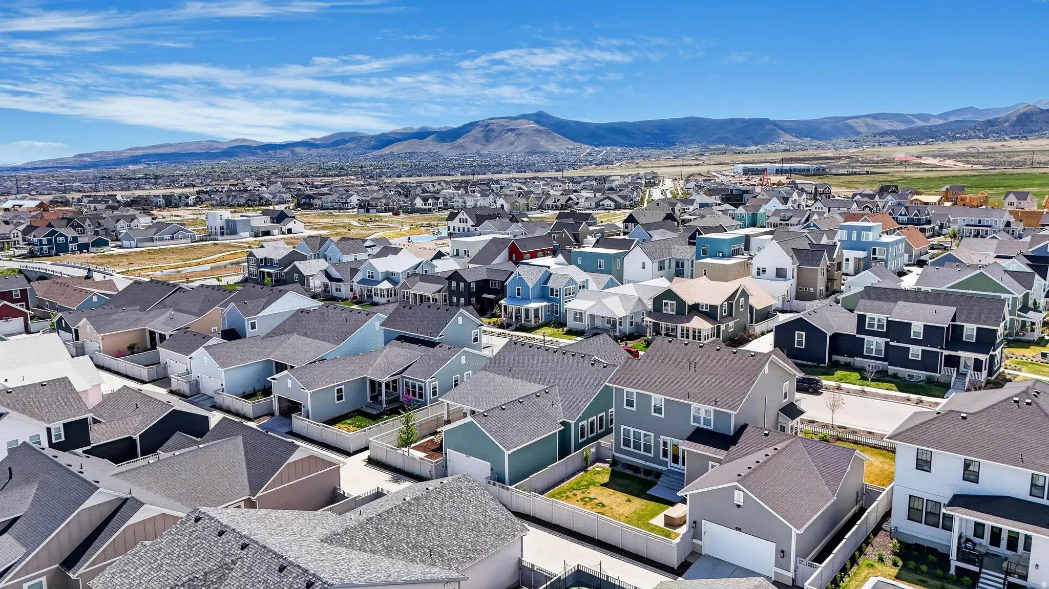 Aerial view of residential area featuring mountains