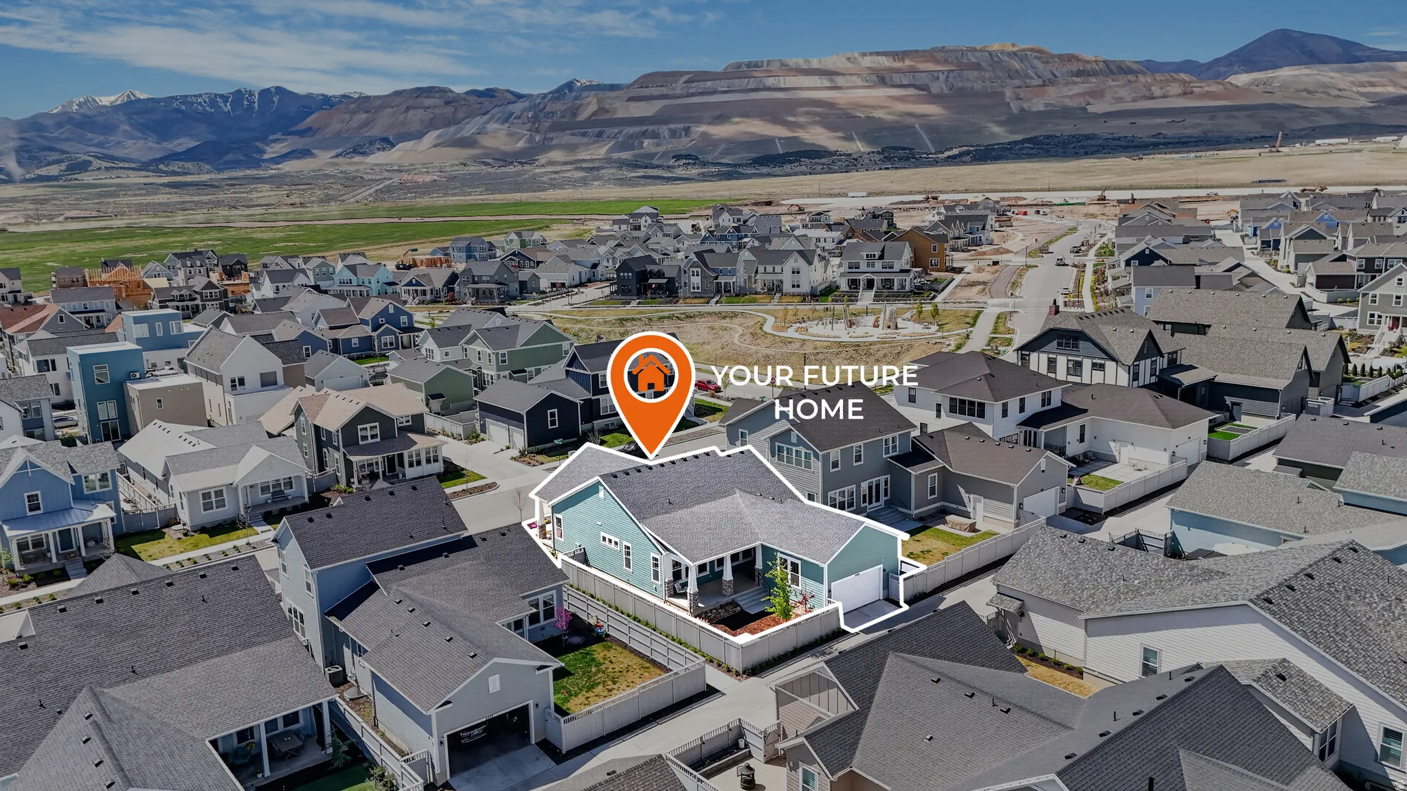 Aerial perspective of suburban area featuring a mountain backdrop