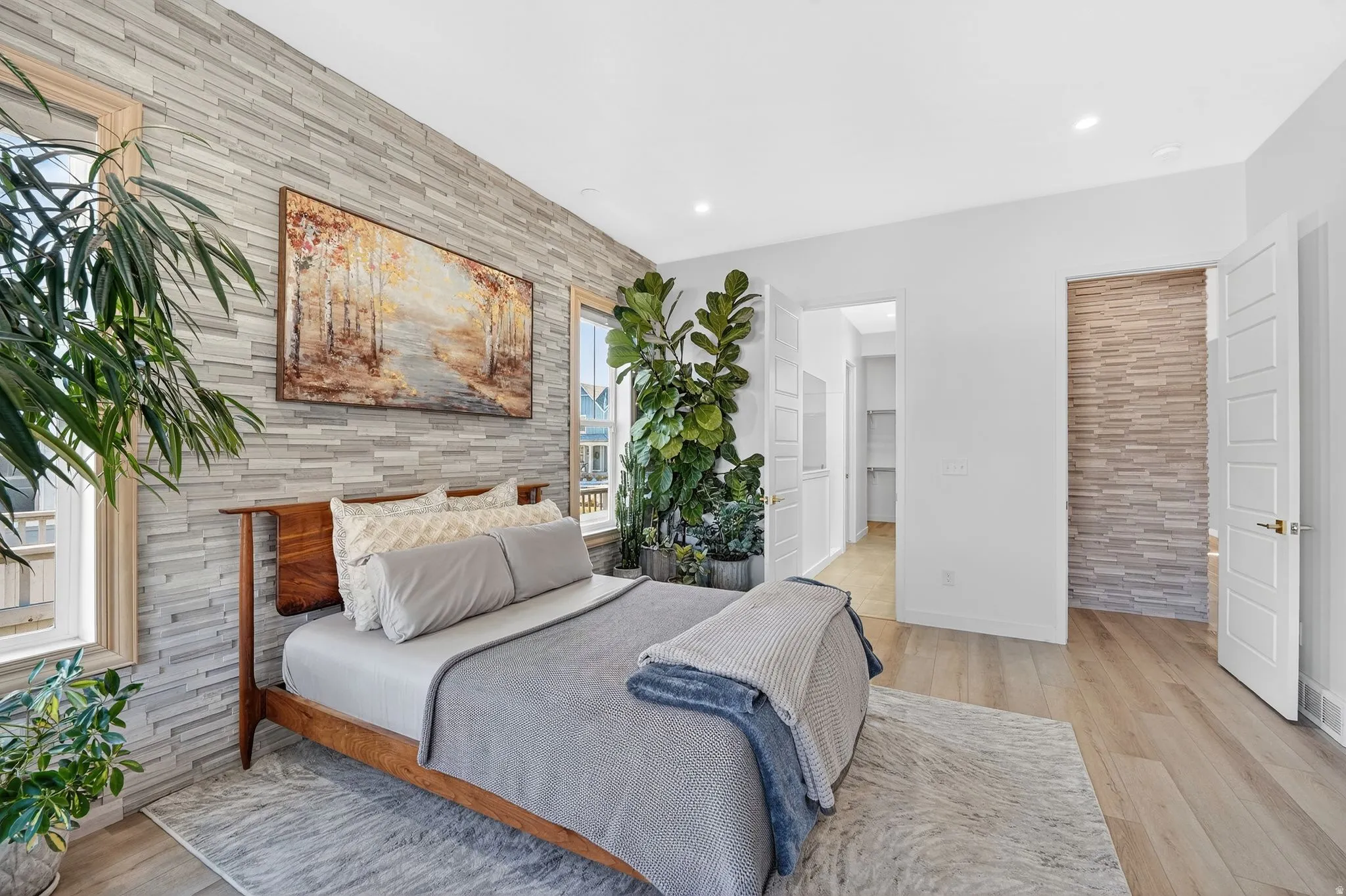 Owner's Suite with tons of natural light and beautiful upgraded accent stone wall