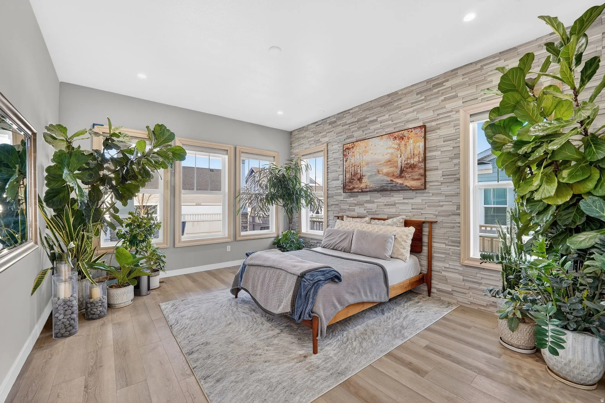 Owner's Suite with tons of natural light and beautiful upgraded accent stone wall