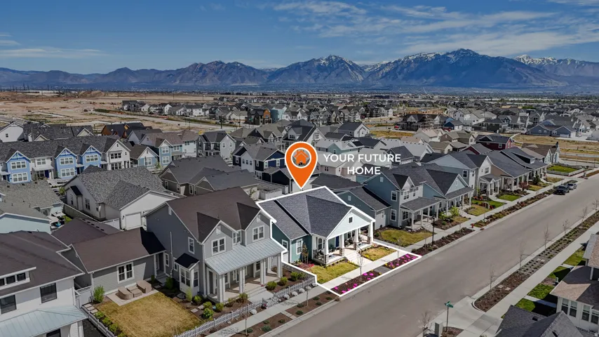 Aerial perspective of suburban area featuring a mountain backdrop