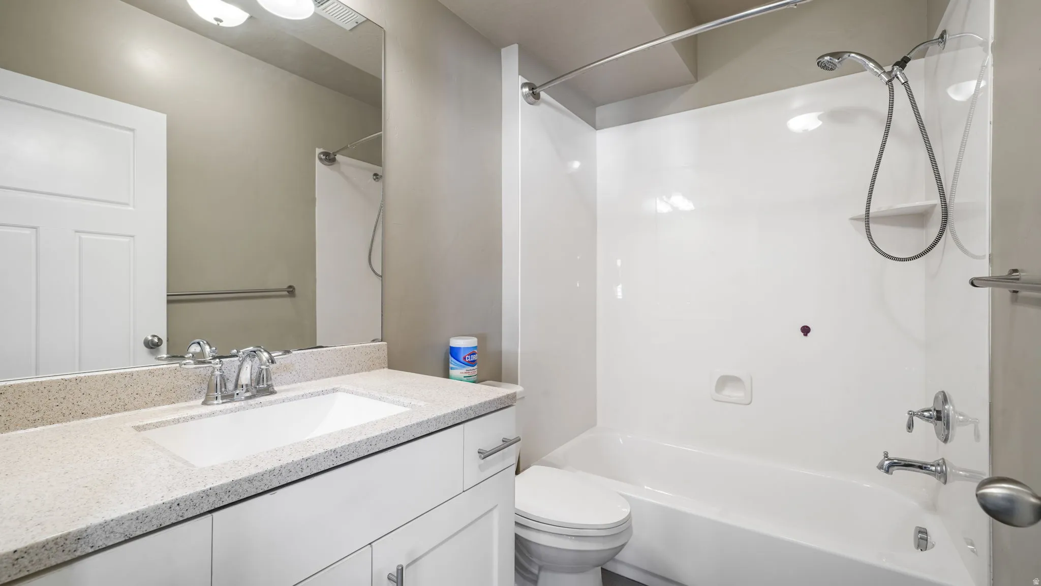 Bathroom with shower / washtub combination and vanity