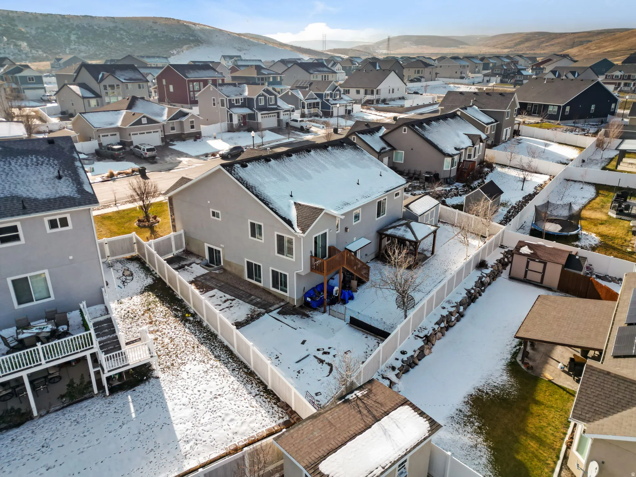 Aerial perspective of suburban area featuring a mountain backdrop