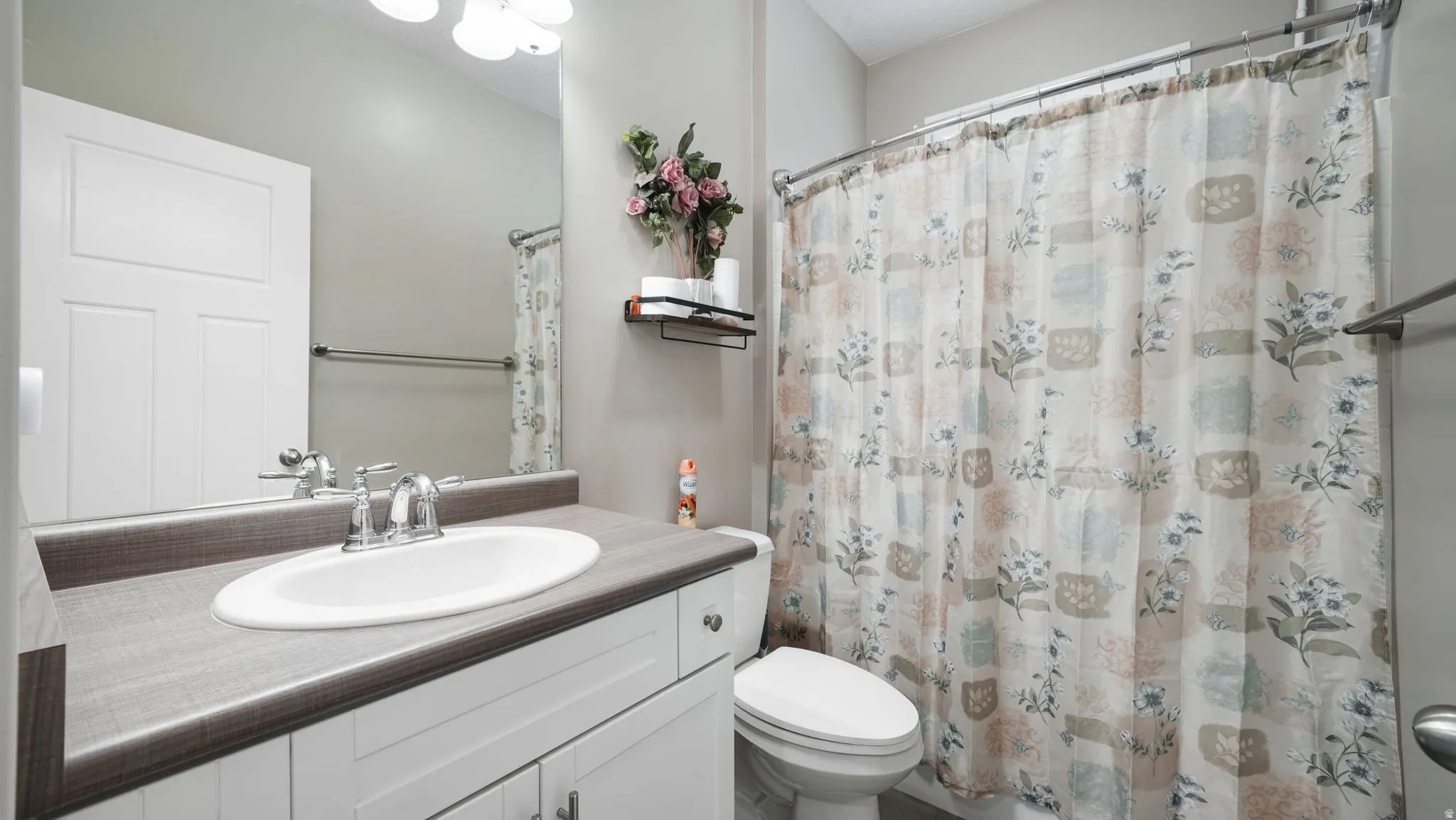 Bathroom featuring vanity and a shower with curtain