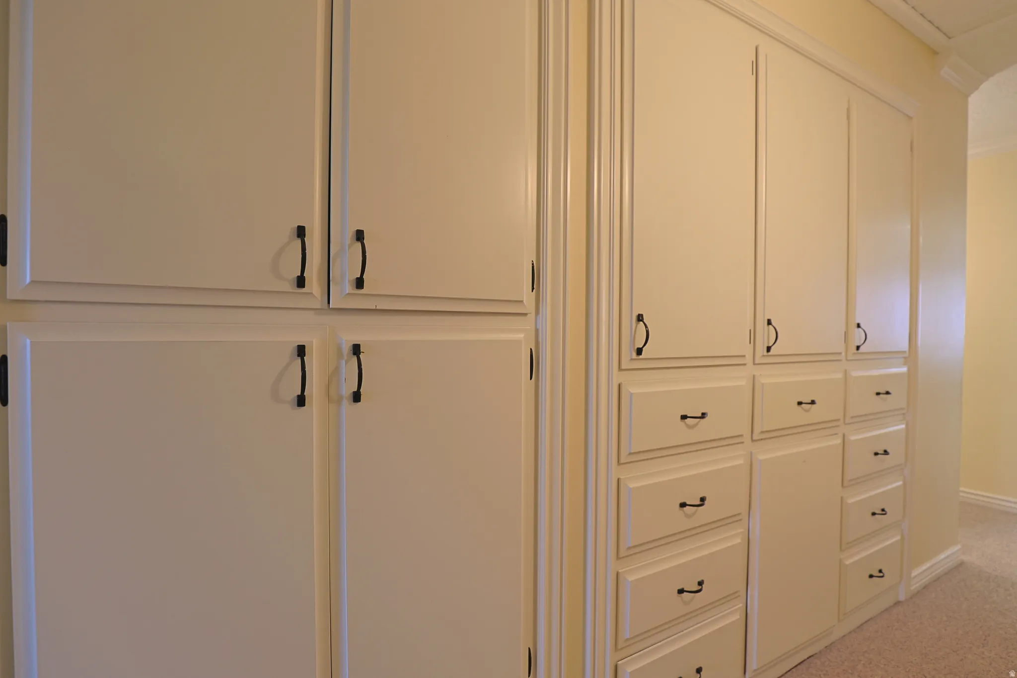 Detailed view of carpet flooring and baseboards