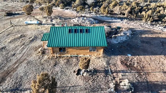Aerial view of property and surrounding area featuring a desert landscape