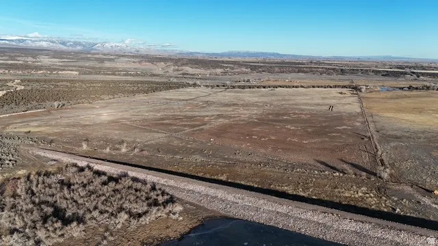 View of rural area featuring a desert landscape and a mountainous background