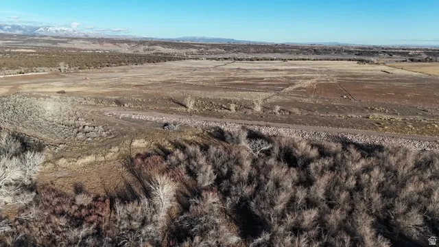 Aerial view of property and surrounding area with rural landscape and a desert landscape