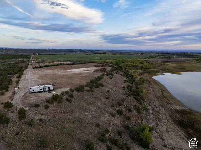 Expansive land parcel featuring natural terrain and water frontage