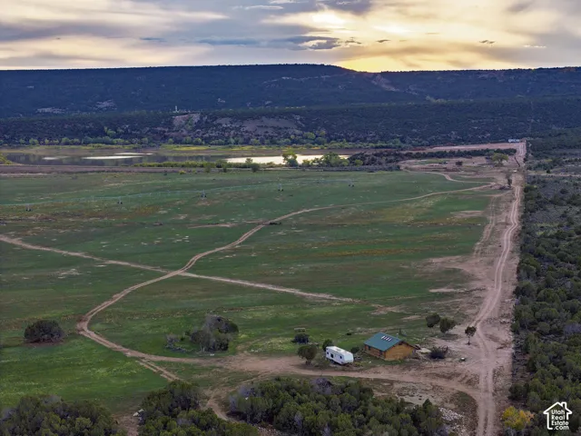 Rolling green fields, multiple water bodies, and a natural landscape